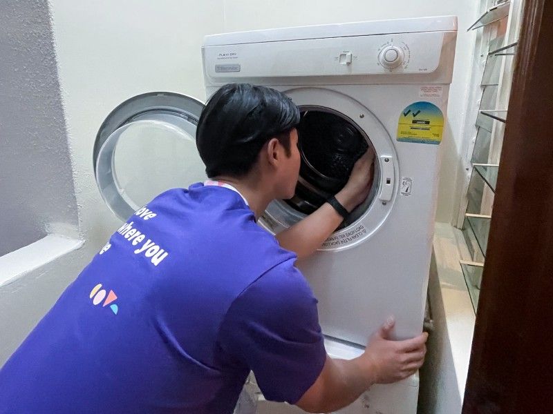 Cove Ops team fixing the washing machine