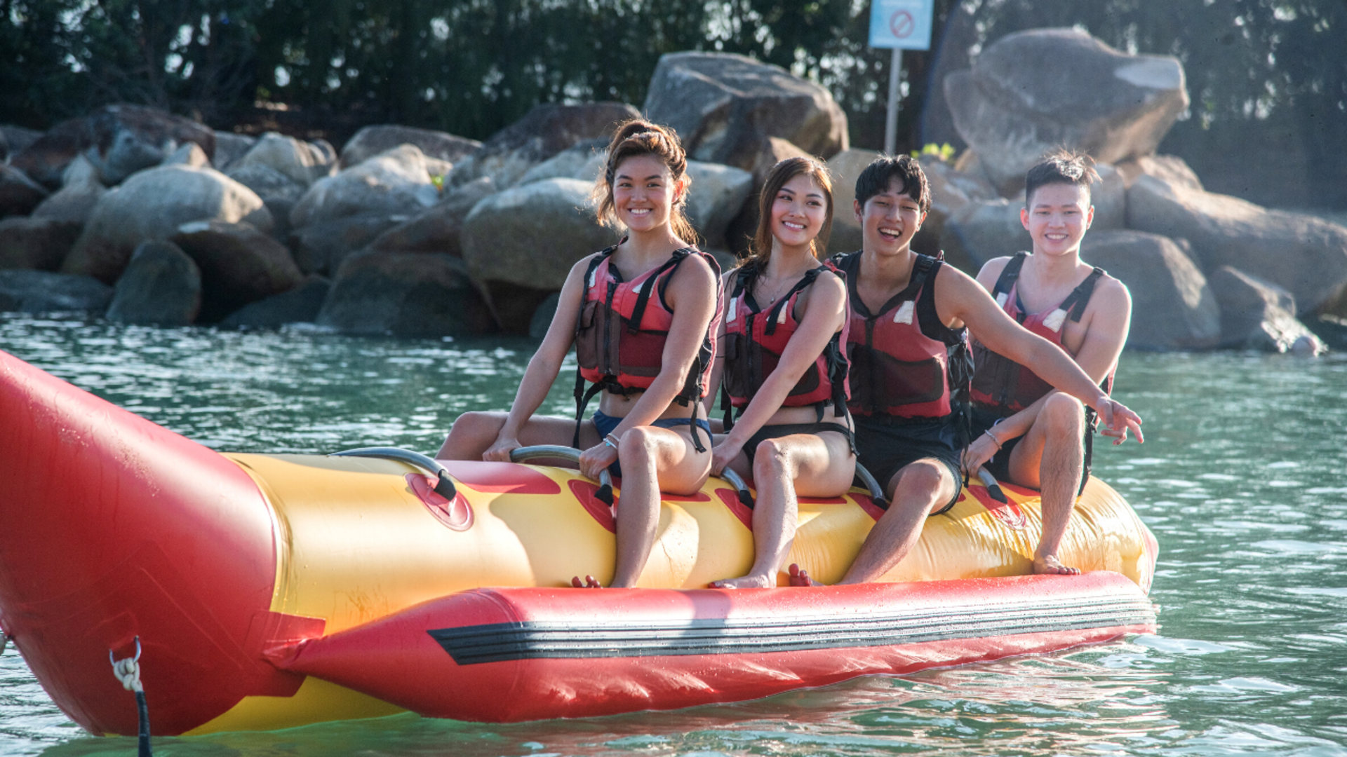 young asian youths on a banana boat